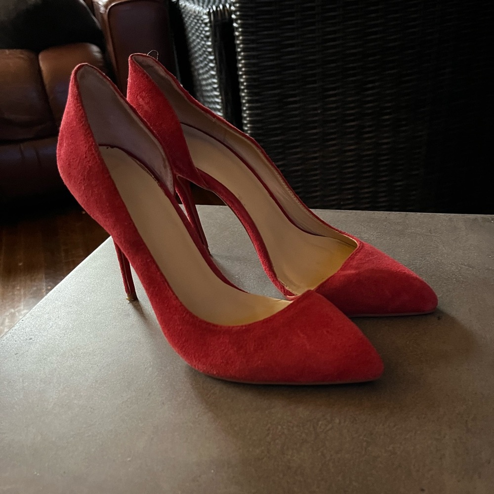 These beautiful red heels were worn only once.
